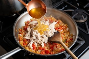 add chicken and broth to aromatics